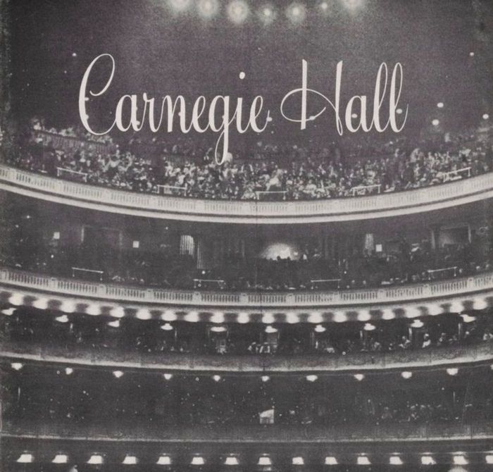 Old black and white photo of Carnegie Hall's balconies full of people
