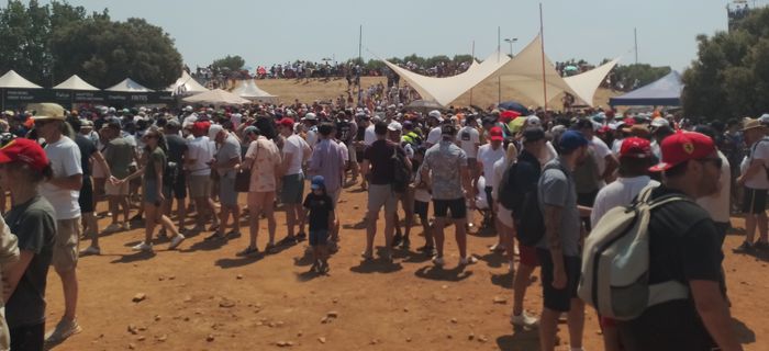 Photo of crowd walking around between stands and shops at Paul Ricard circuit