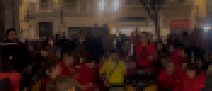 Pixelated photo of me playing the surdo dream among in the corner of a big drumming jam