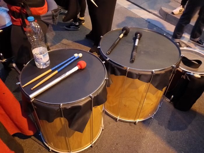 Photo of 2 surdo drums sitting on the floor.